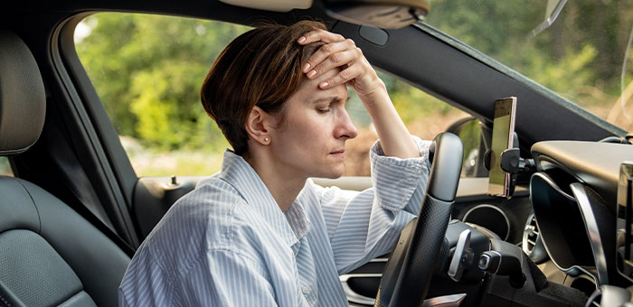 patient with headaches needing auto accident chiropractor in Addison