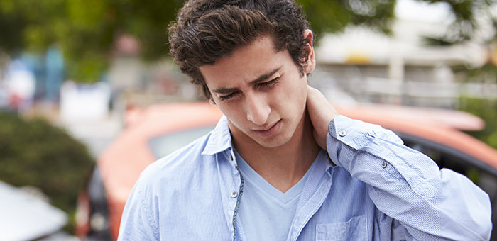 patient with pinched nerve needing auto accident chiropractor in Addison